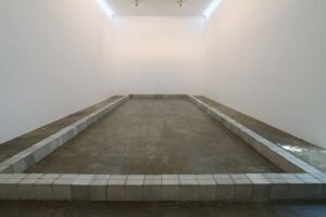 The Nature of a Surrounded Site, 985 x 422 x 20 cm, cement block, 2016